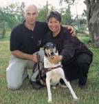 Social worker Daphna Golan-Shemesh and professional dog trainer Yariv Ben Yosef pose with Polly, the first dog trained specifically to improve the quality of life for Alzheimer's patients. 